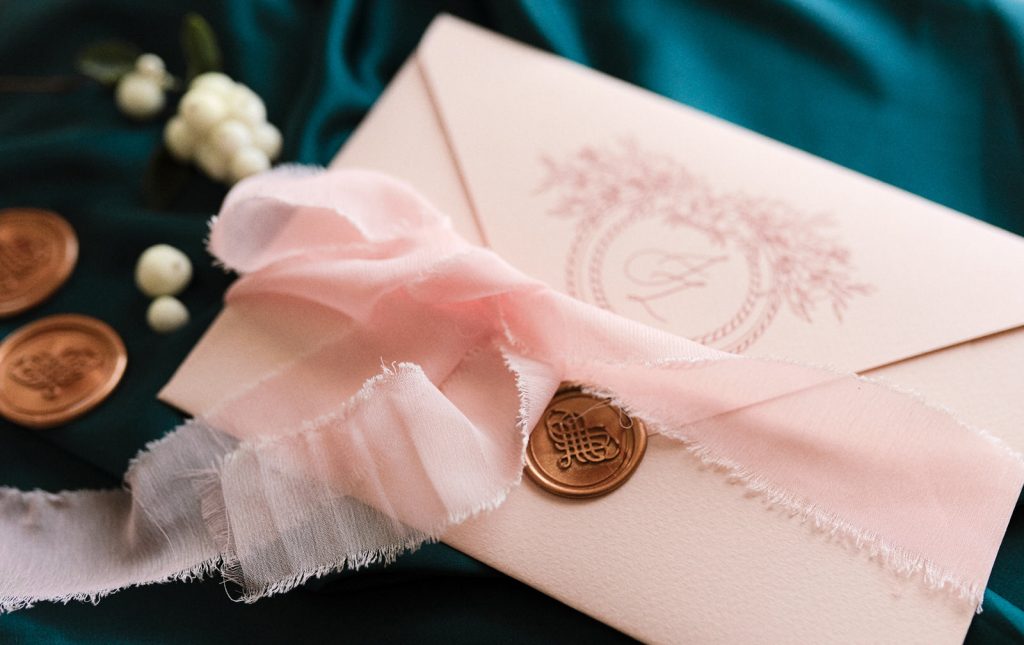 blush-pink-envelope-with-wax-seal-sticker